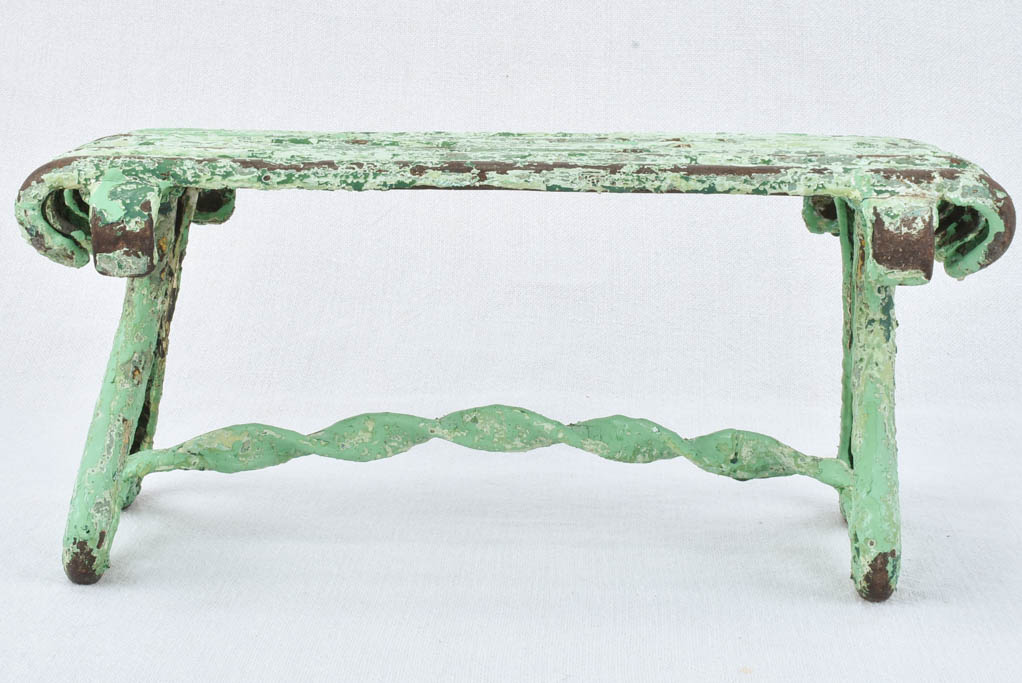 Antique garden footrest with green patina
