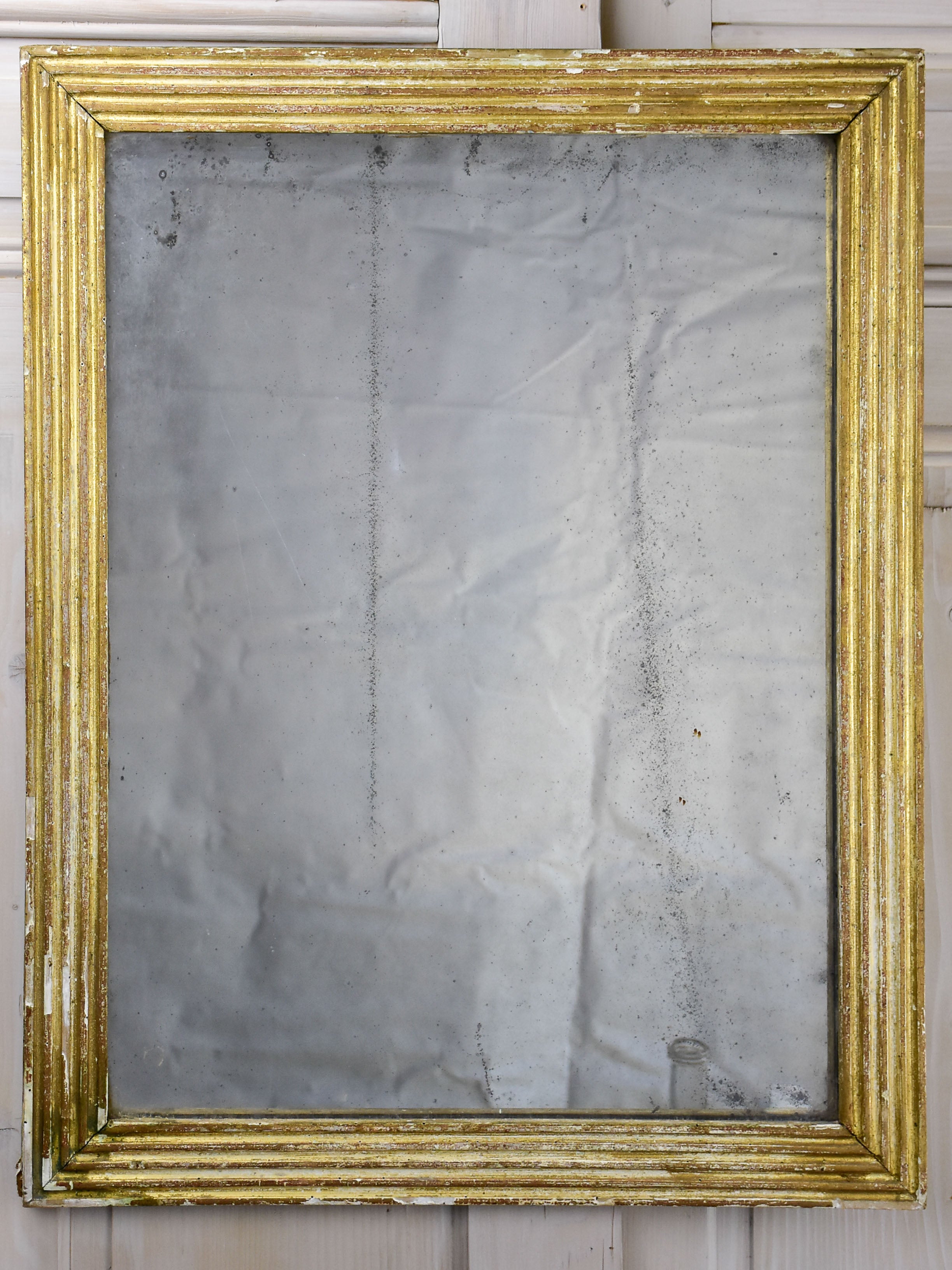 Antique Louis XVI mirror with reeded frame