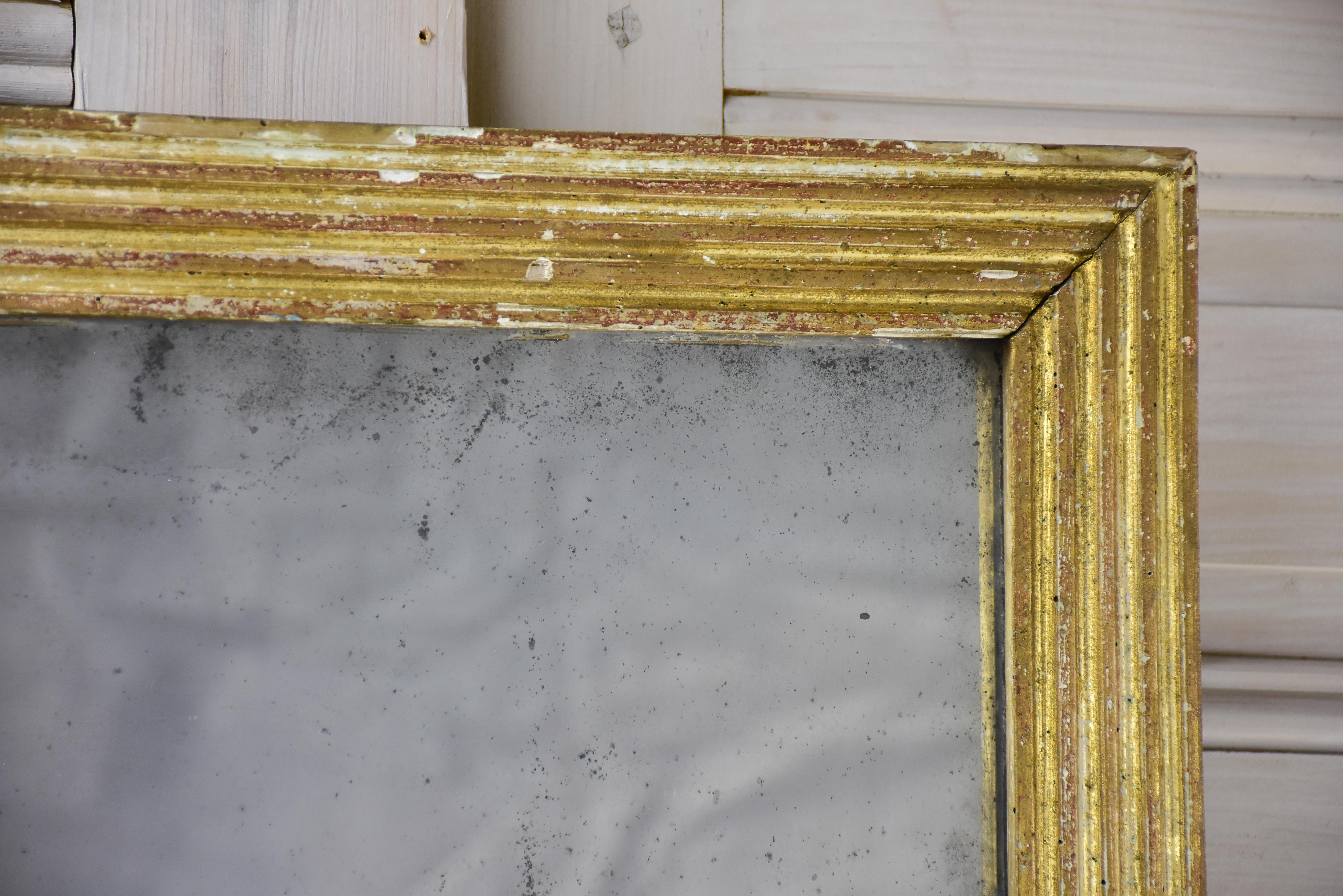 Antique Louis XVI mirror with reeded frame