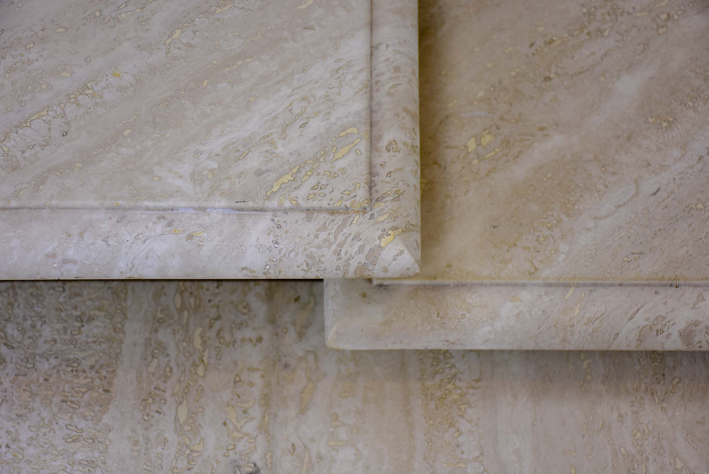 Three vintage travertine nesting side tables