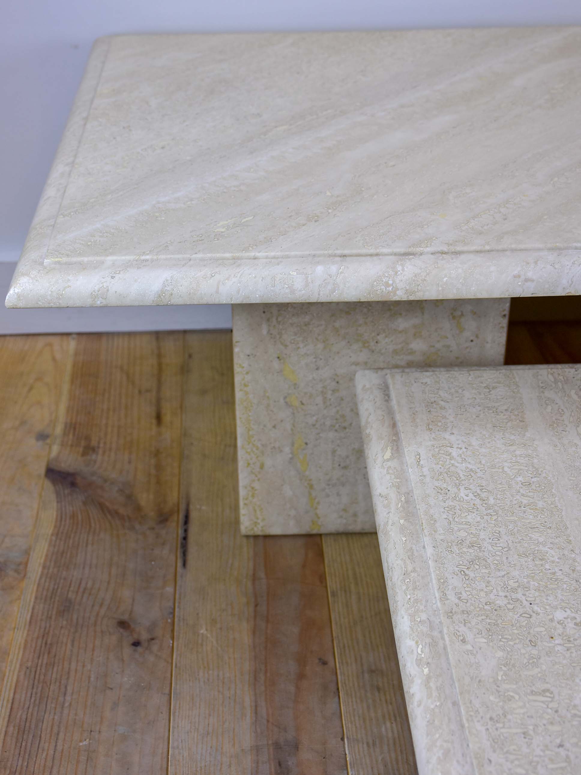 Three vintage travertine nesting side tables