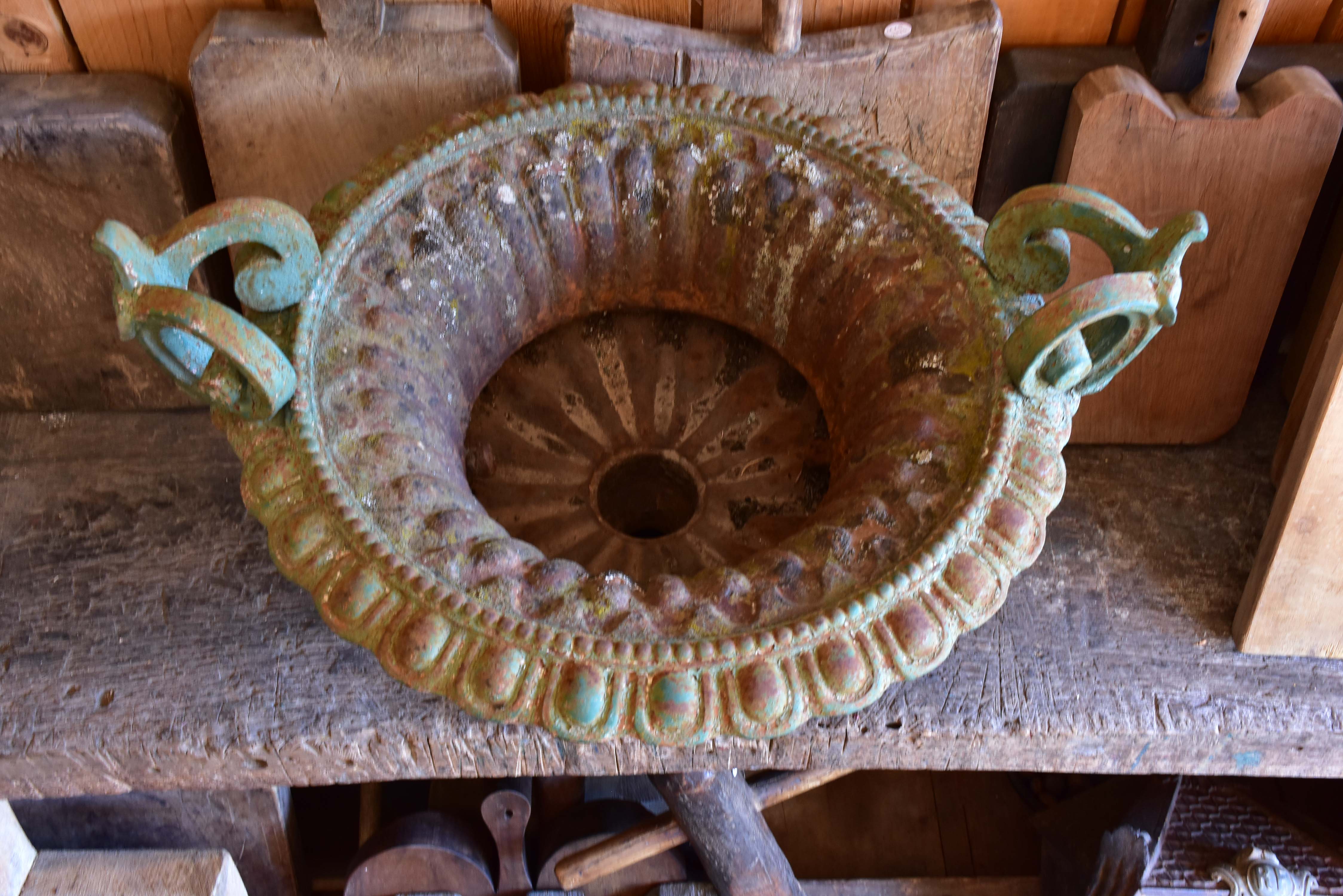 Late 19th century Chambord garden urn with green patina and decorative handles