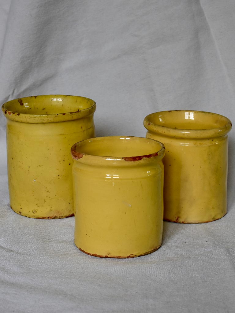 Collection of three antique French preserving pots with yellow glaze