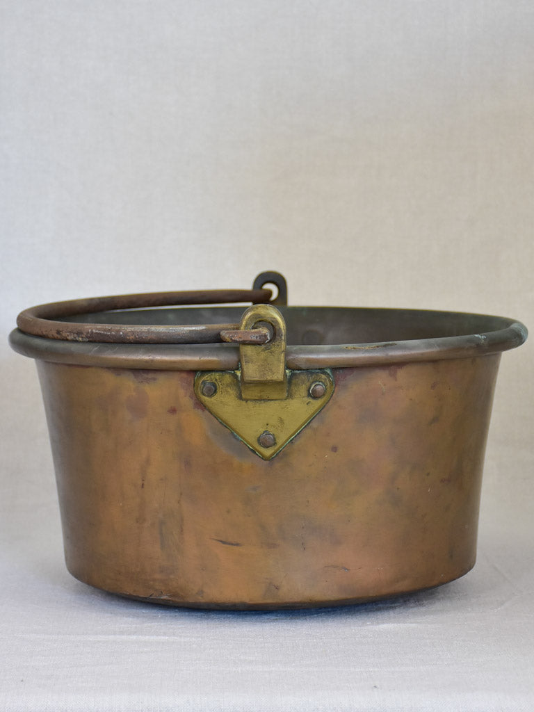 Broad French winemaker's copper with arching handle from the 19th century 17¼"