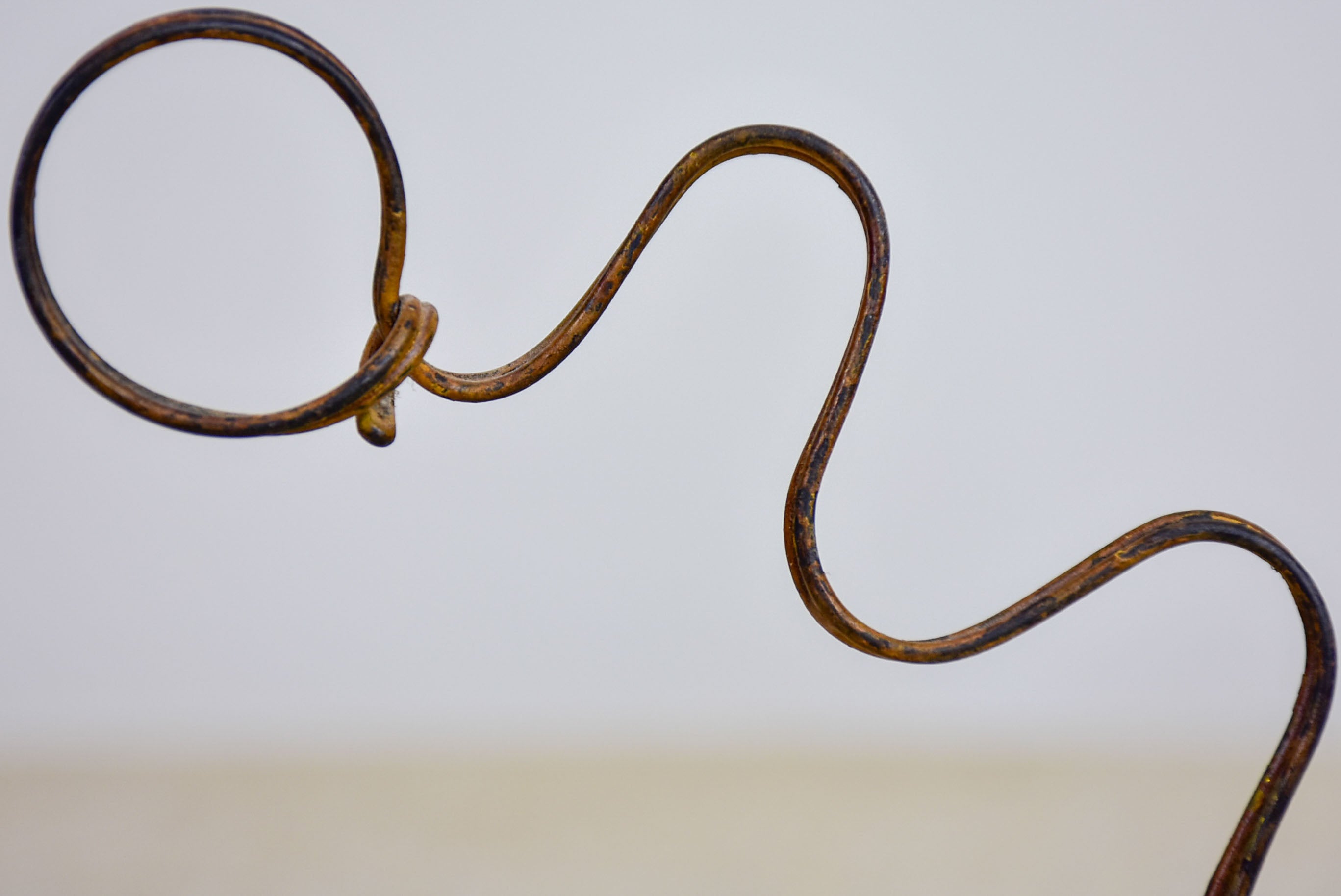 Antique cowboy lasso sculpture