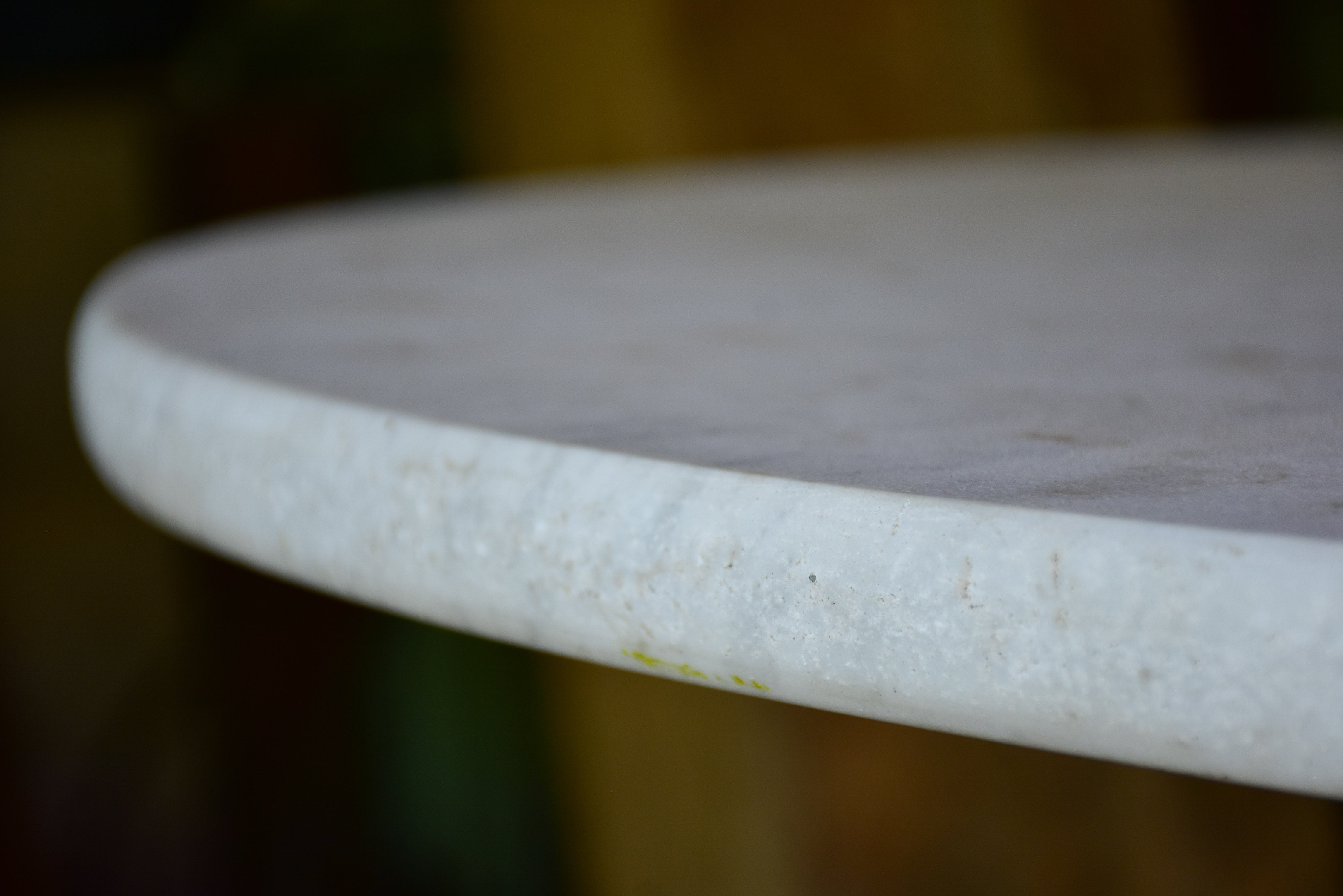 Round marble-top table with cast iron base