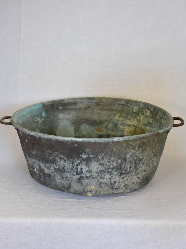 Broad antique French cauldron with two small handles and a drainage hole 30¼"