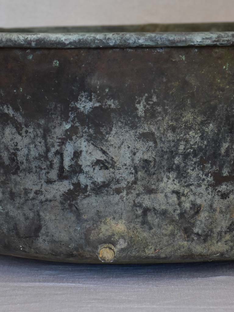 Broad antique French cauldron with two small handles and a drainage hole 30¼"