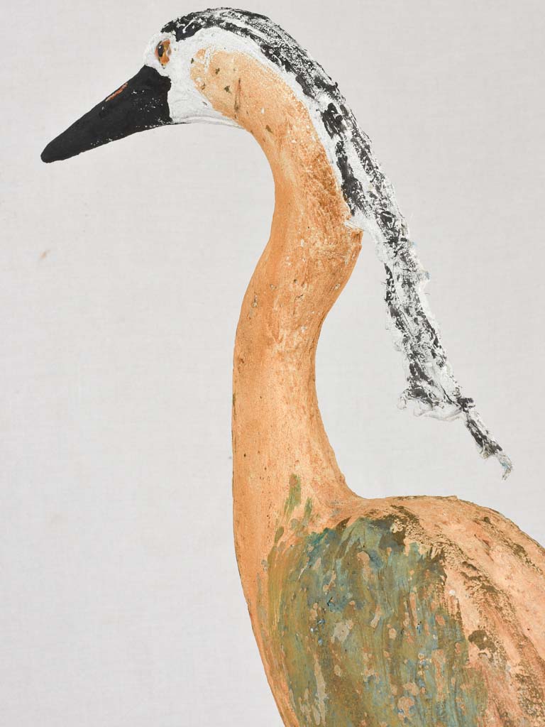 Stone-crafted heron on rock piece