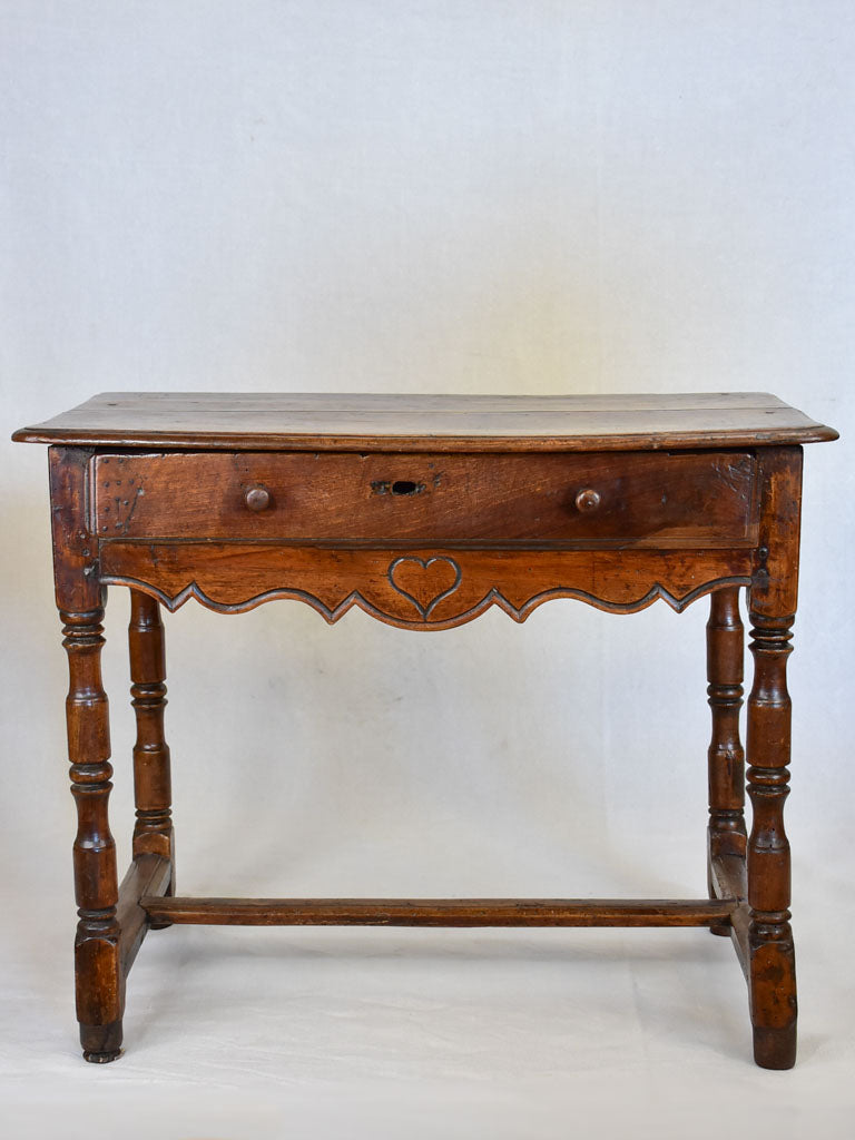 Louis XIII walnut side table with drawer and heart motif