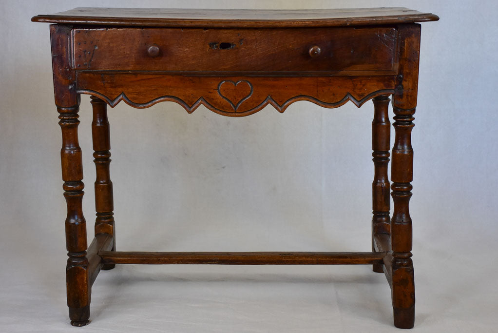 Louis XIII walnut side table with drawer and heart motif