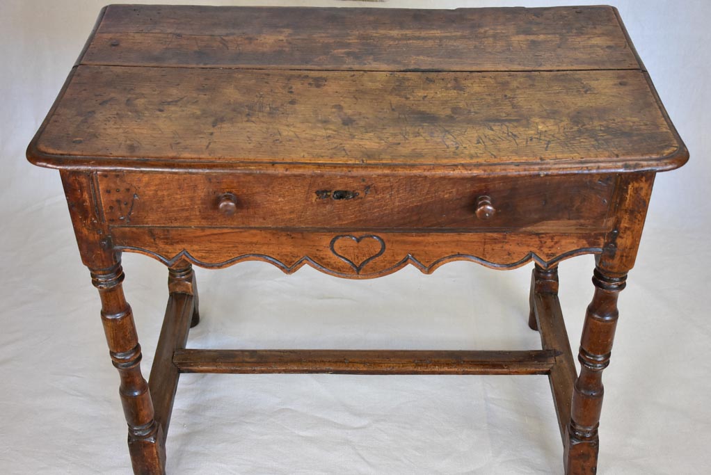 Louis XIII walnut side table with drawer and heart motif