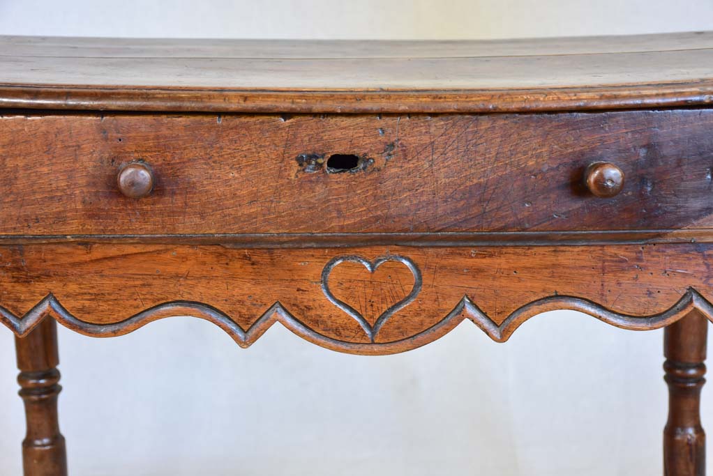 Louis XIII walnut side table with drawer and heart motif