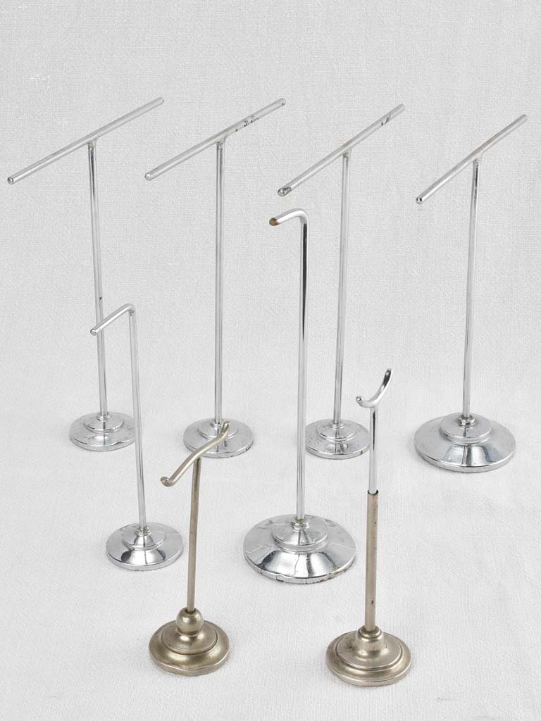 Collection of 8 antique jewelry display racks