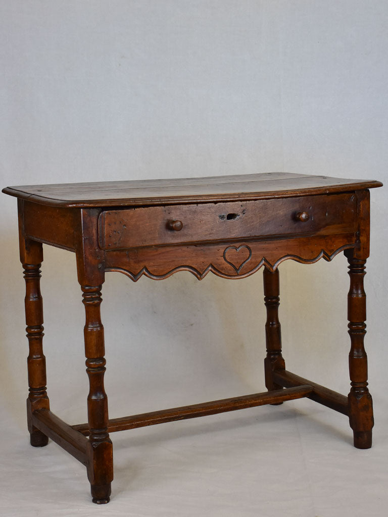 Louis XIII walnut side table with drawer and heart motif