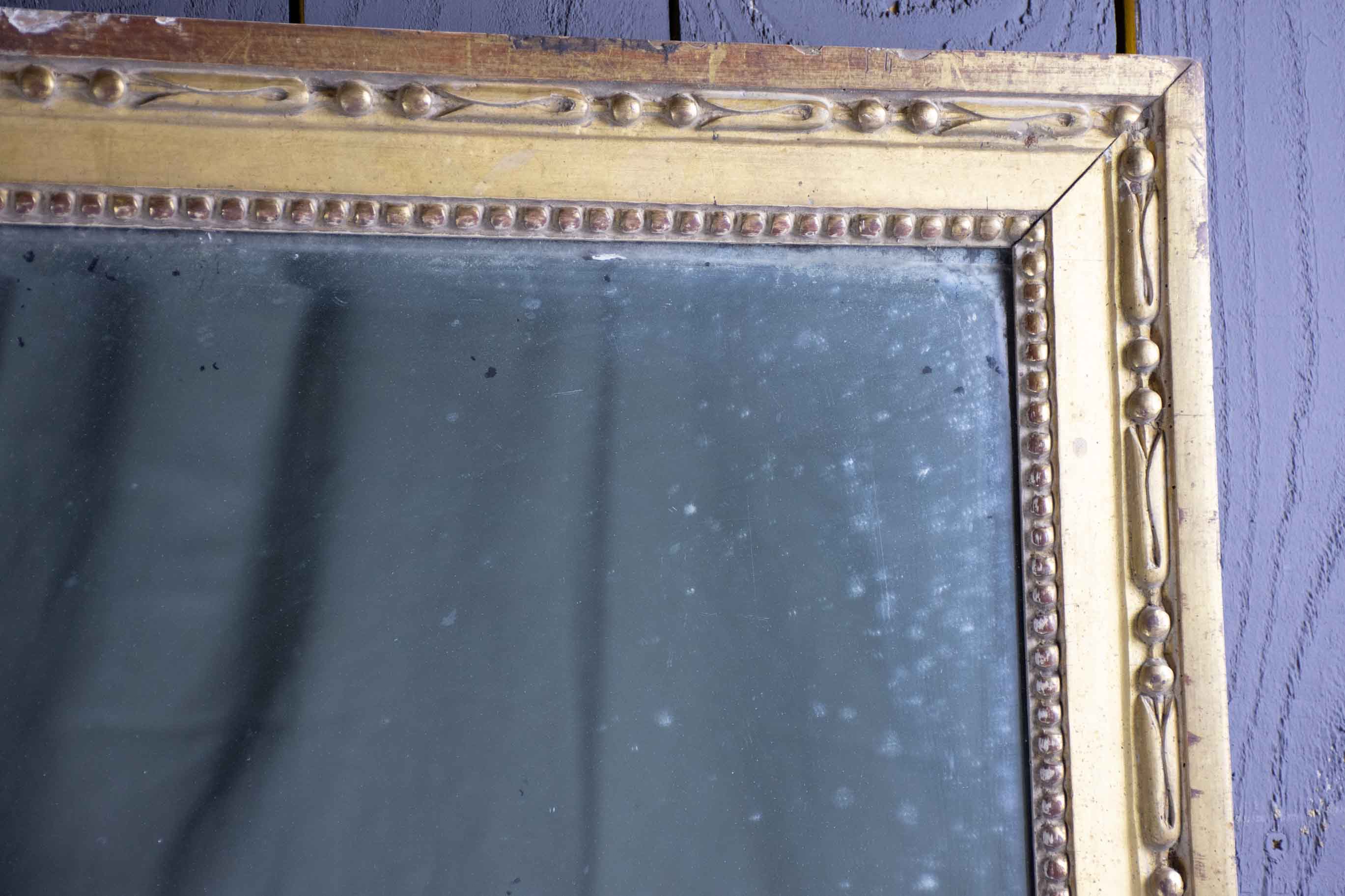 Louis XVI mirror with gilded frame and mercury glass