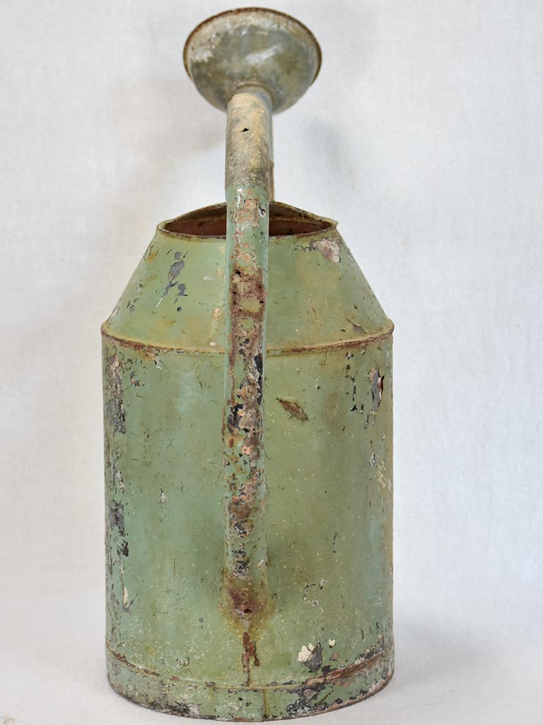 French watering can with green patina