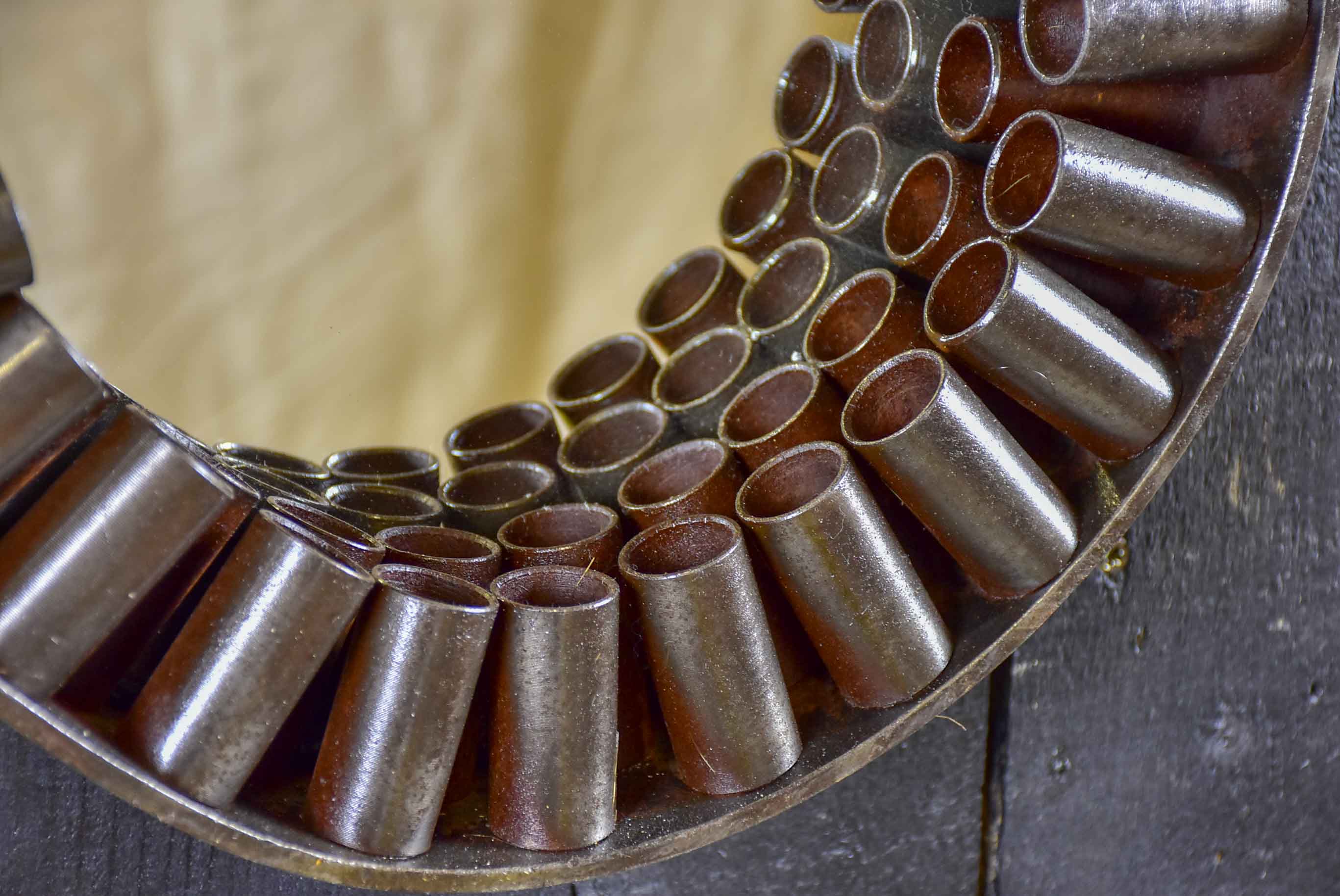 Round mirrors made from salvaged industrial materials