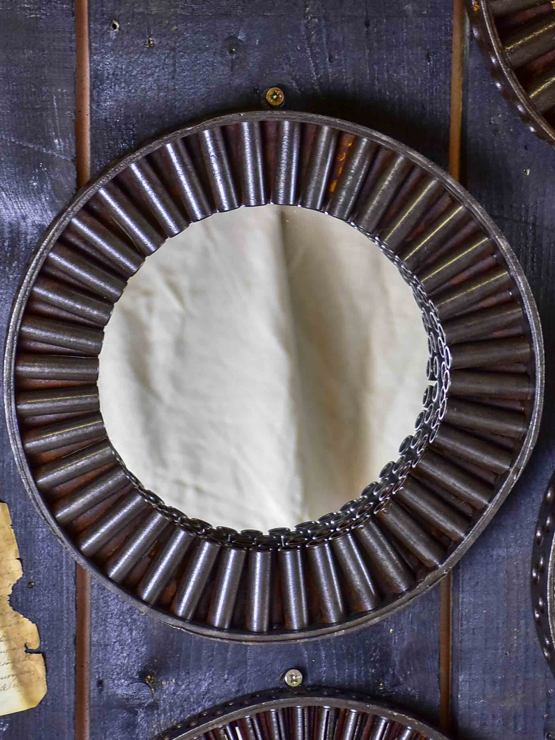 Round mirrors made from salvaged industrial materials