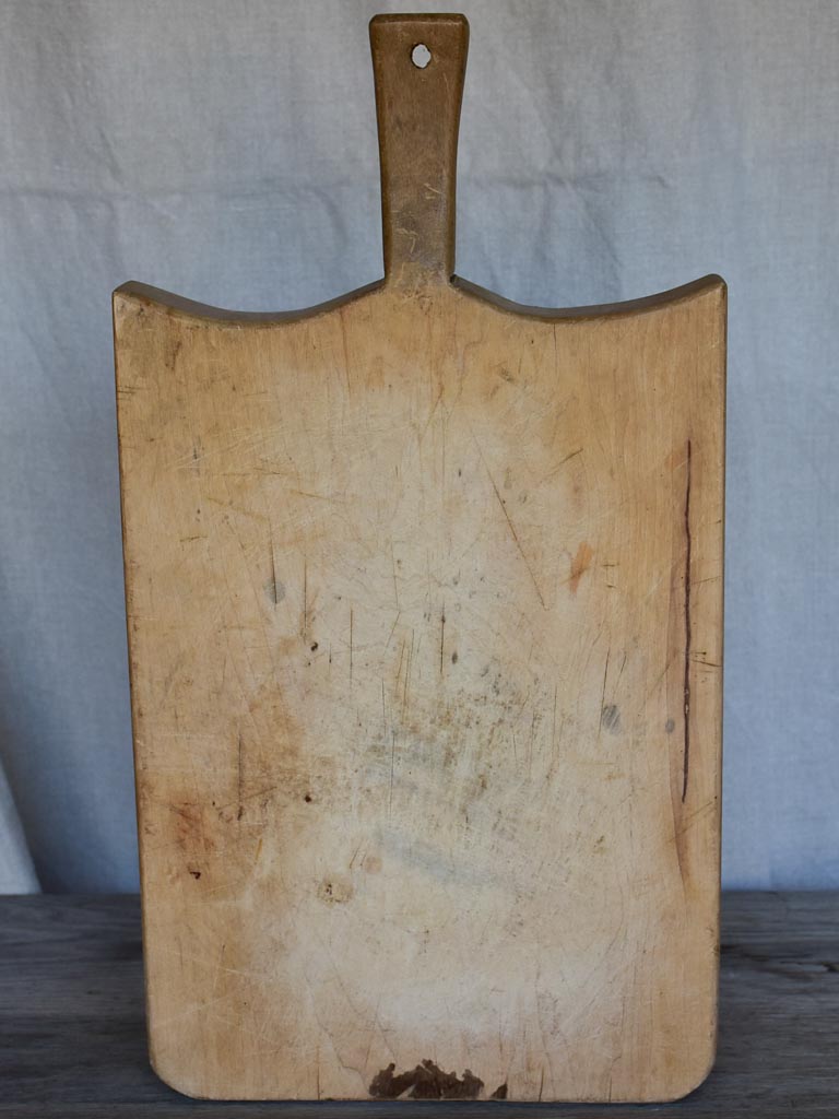 Thick antique French cutting board with rounded peaked shoulders 20¾"