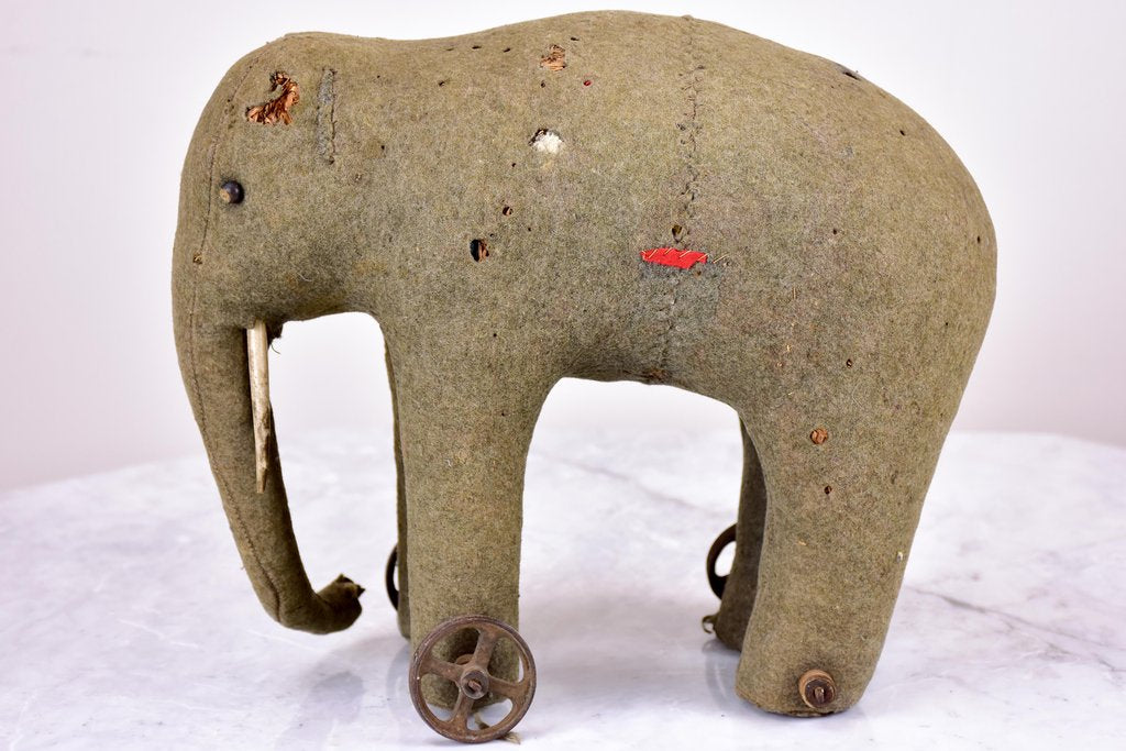 Three antique French toy elephants