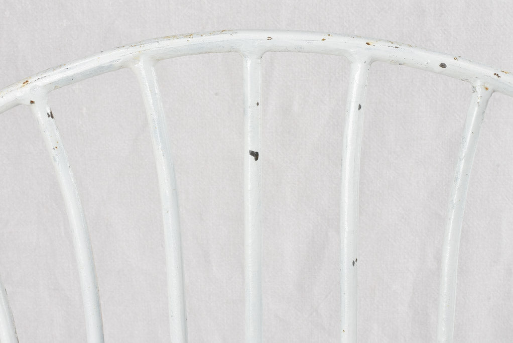 Old-fashioned, distressed finish metal chair