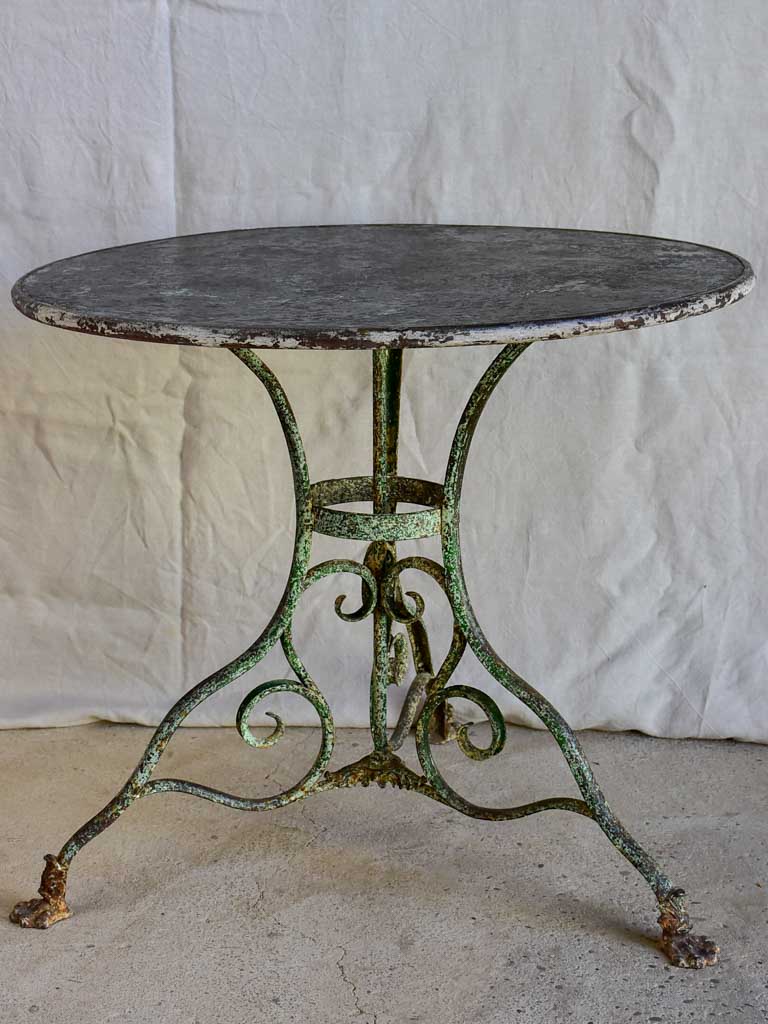 Late 19th Century round Arras garden table with claw feet 32"