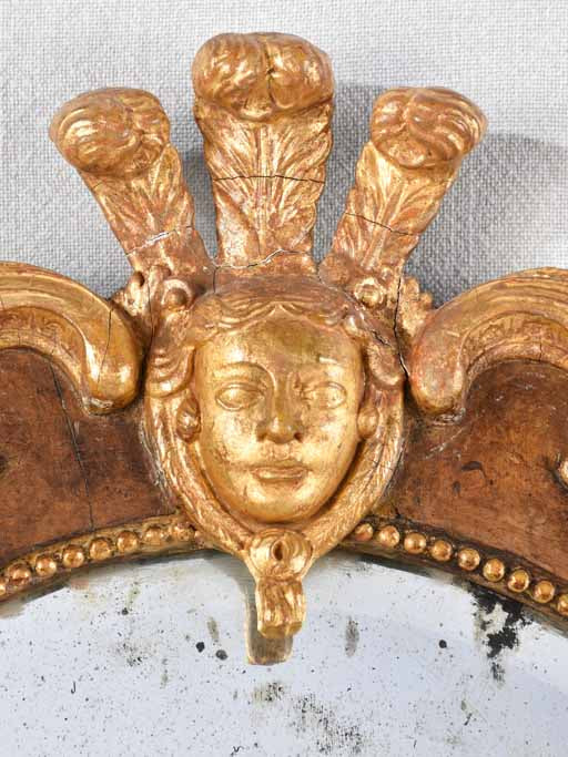 PAIR OF 19TH CENTURY ITALIAN GILT WOOD MIRRORS WITH MASQUERADE PEDIMENT 39½" x 19¾"