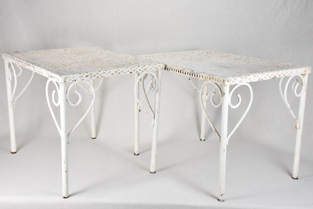 Pair of perforated wrought iron garden coffee tables