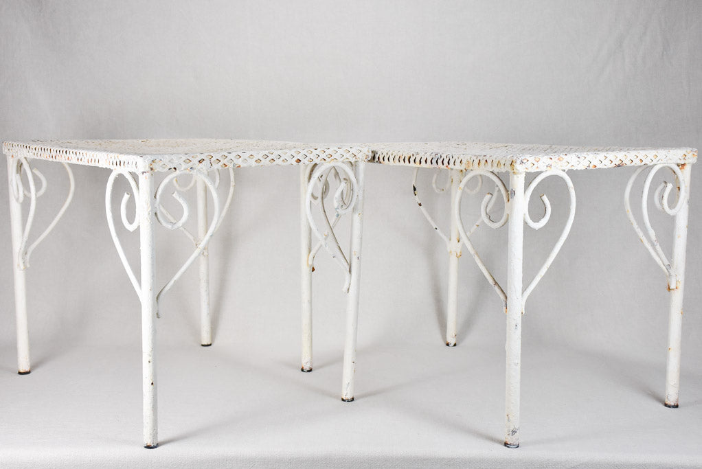 Pair of perforated wrought iron garden coffee tables