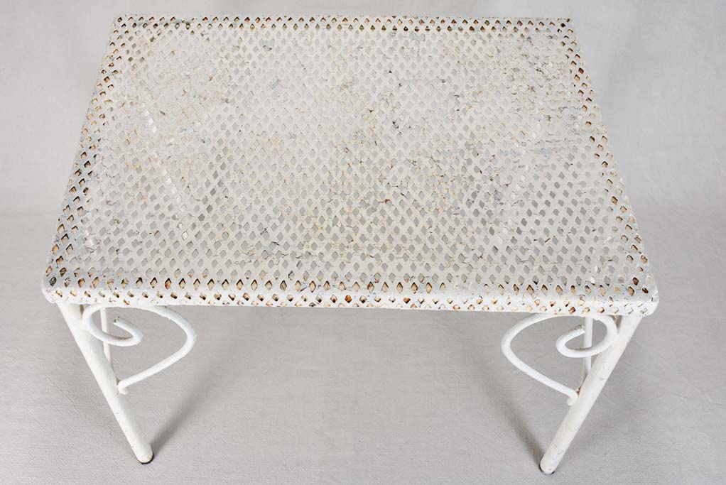 Pair of perforated wrought iron garden coffee tables