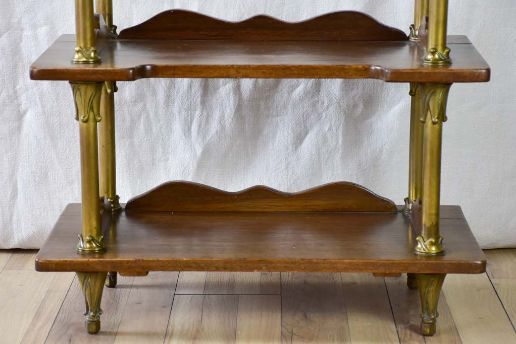 Early twentieth century shelving unit with bronze frame from a boutique 32¼"