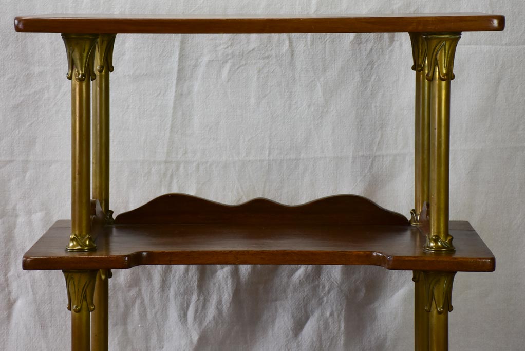 Early twentieth century shelving unit with bronze frame from a boutique 32¼"