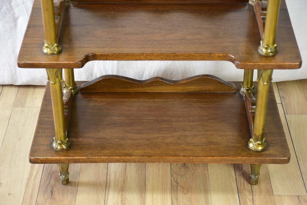 Early twentieth century shelving unit with bronze frame from a boutique 32¼"
