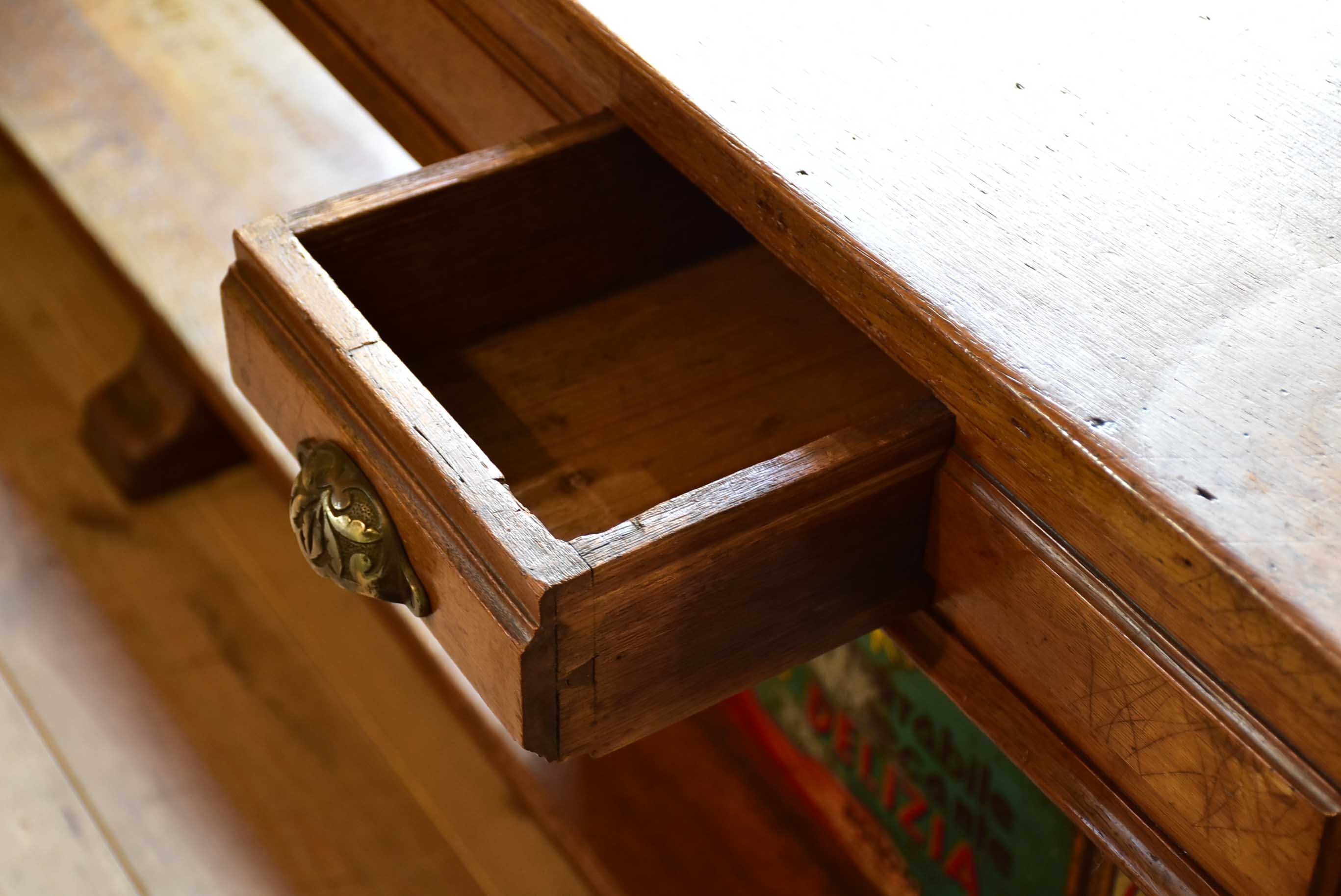 Antique French oak drapery table from a silk boutique