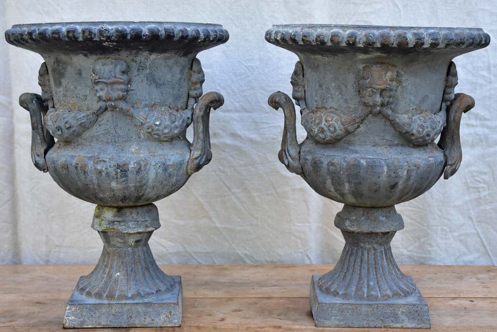 Pair of Napoleon III cast iron garden urns