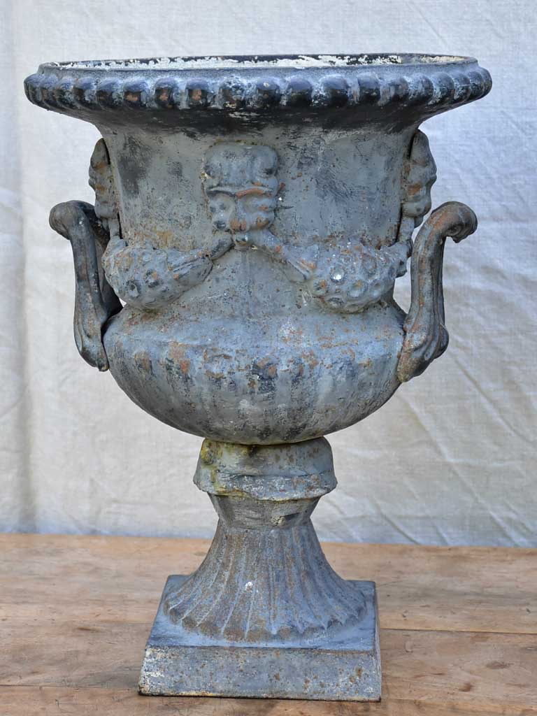 Pair of Napoleon III cast iron garden urns