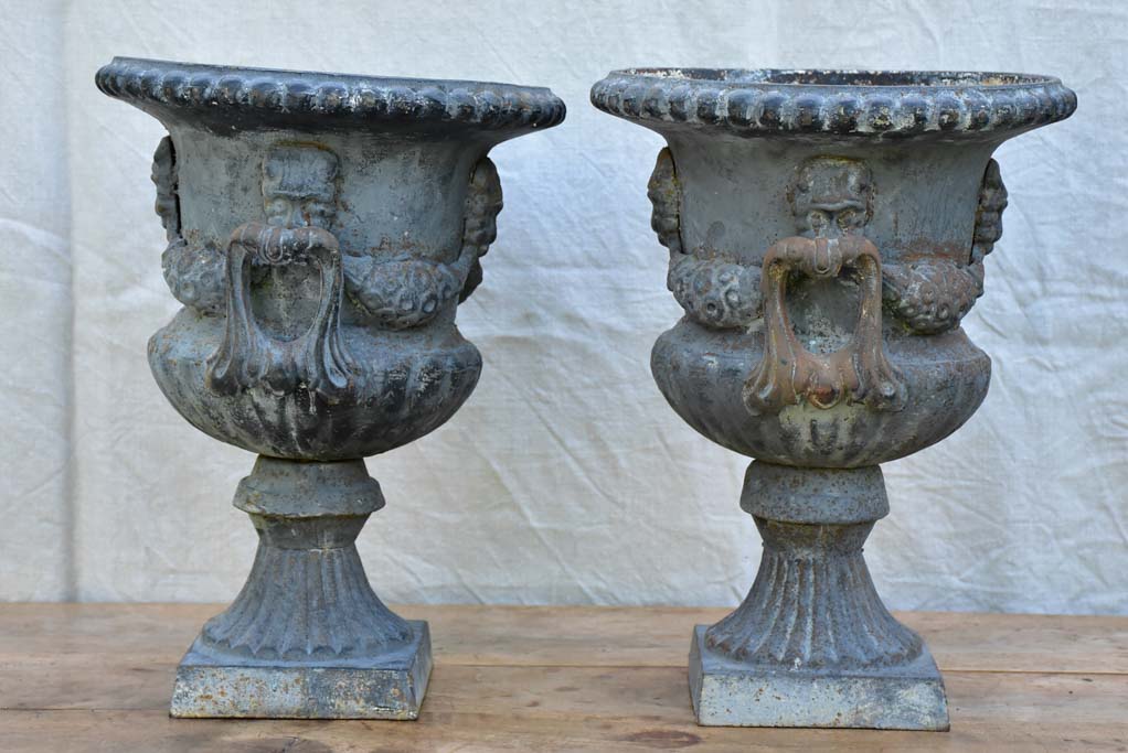 Pair of Napoleon III cast iron garden urns
