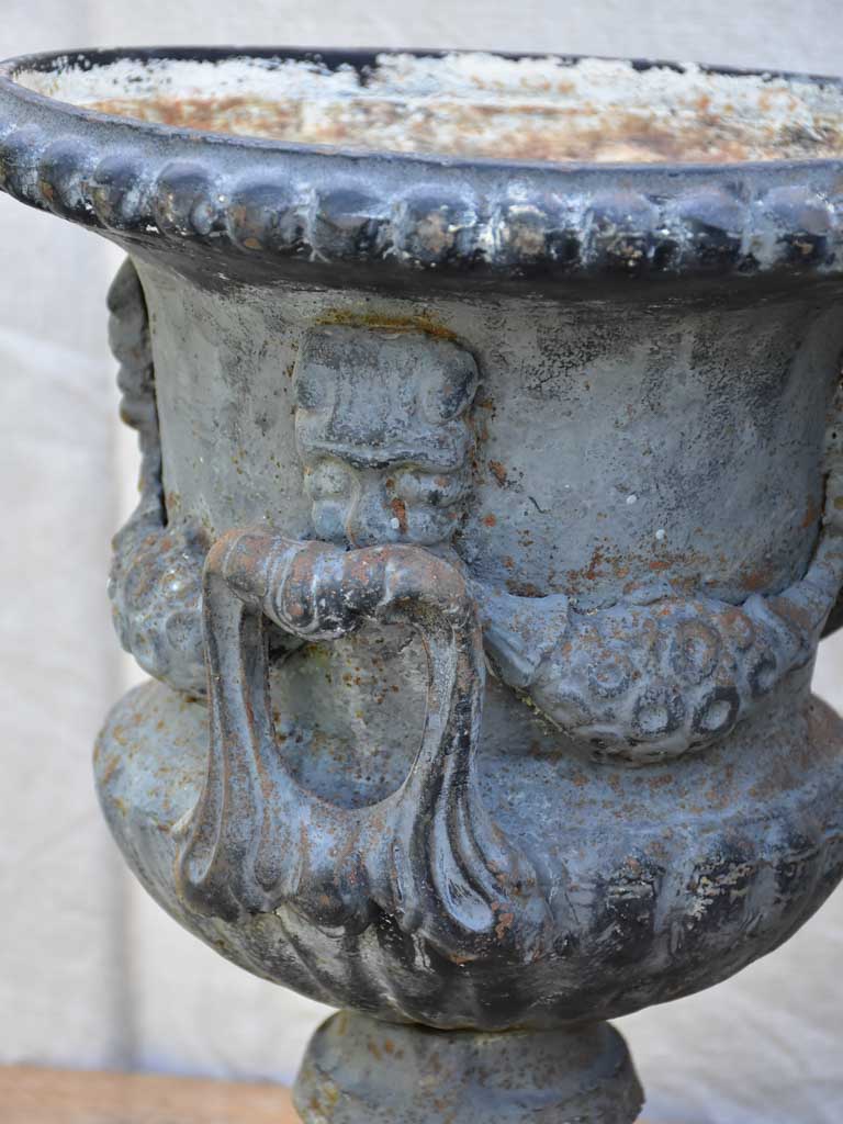 Pair of Napoleon III cast iron garden urns