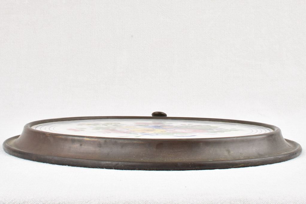 Vintage ceramic and brass trivet