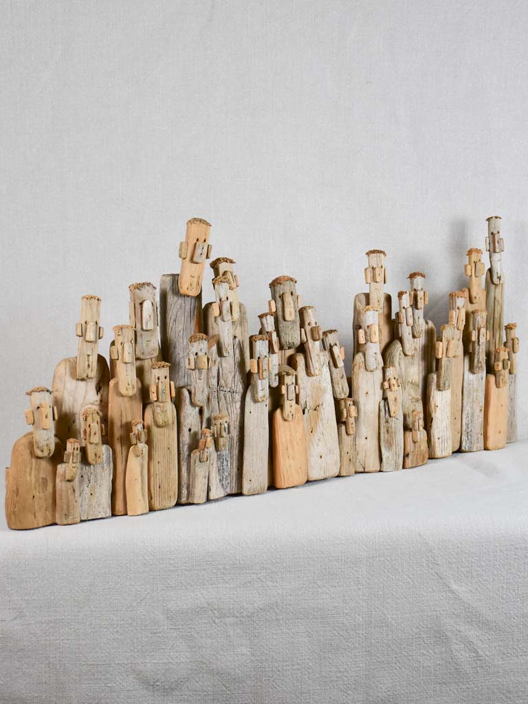 Panoramic driftwood sculpture by JP Dreano - 34 characters 27½"
