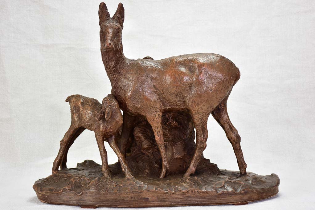 Early 20th Century clay sculpture of a deer and faun 13¾"
