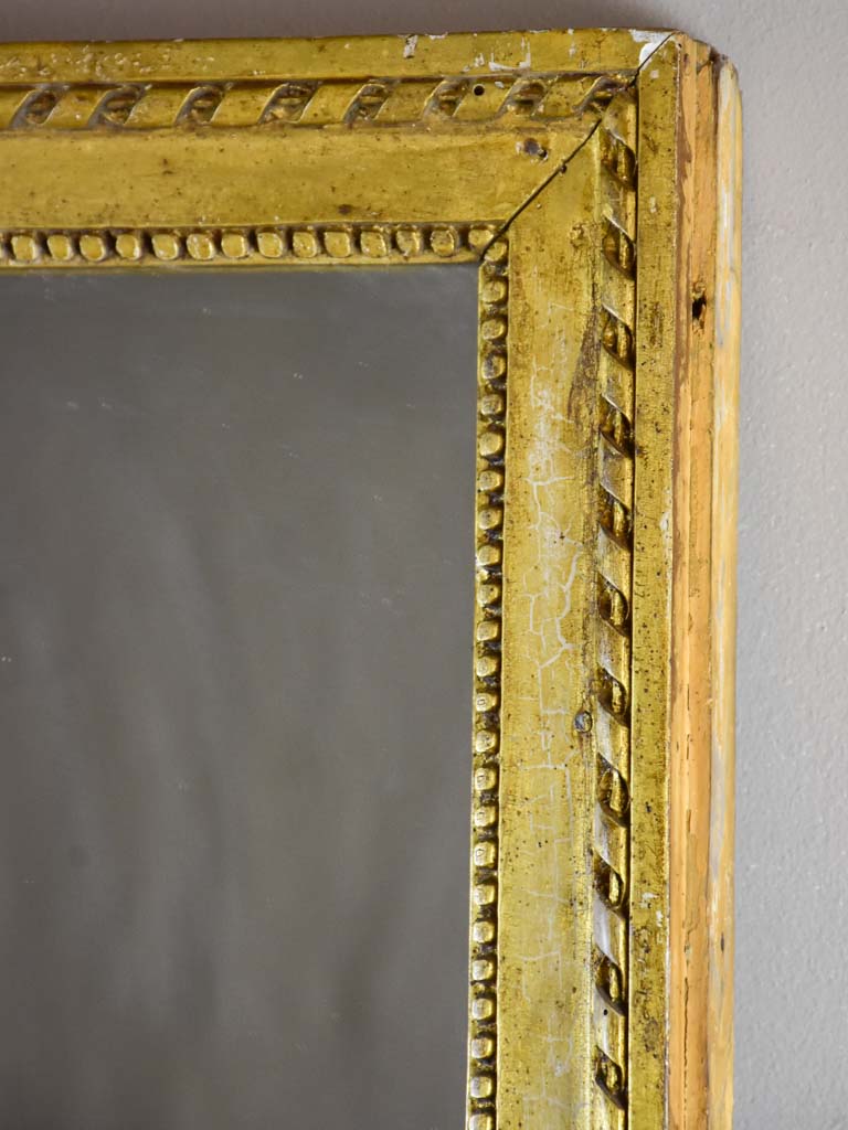 Early 19th Century French mirror with fatigued gold frame