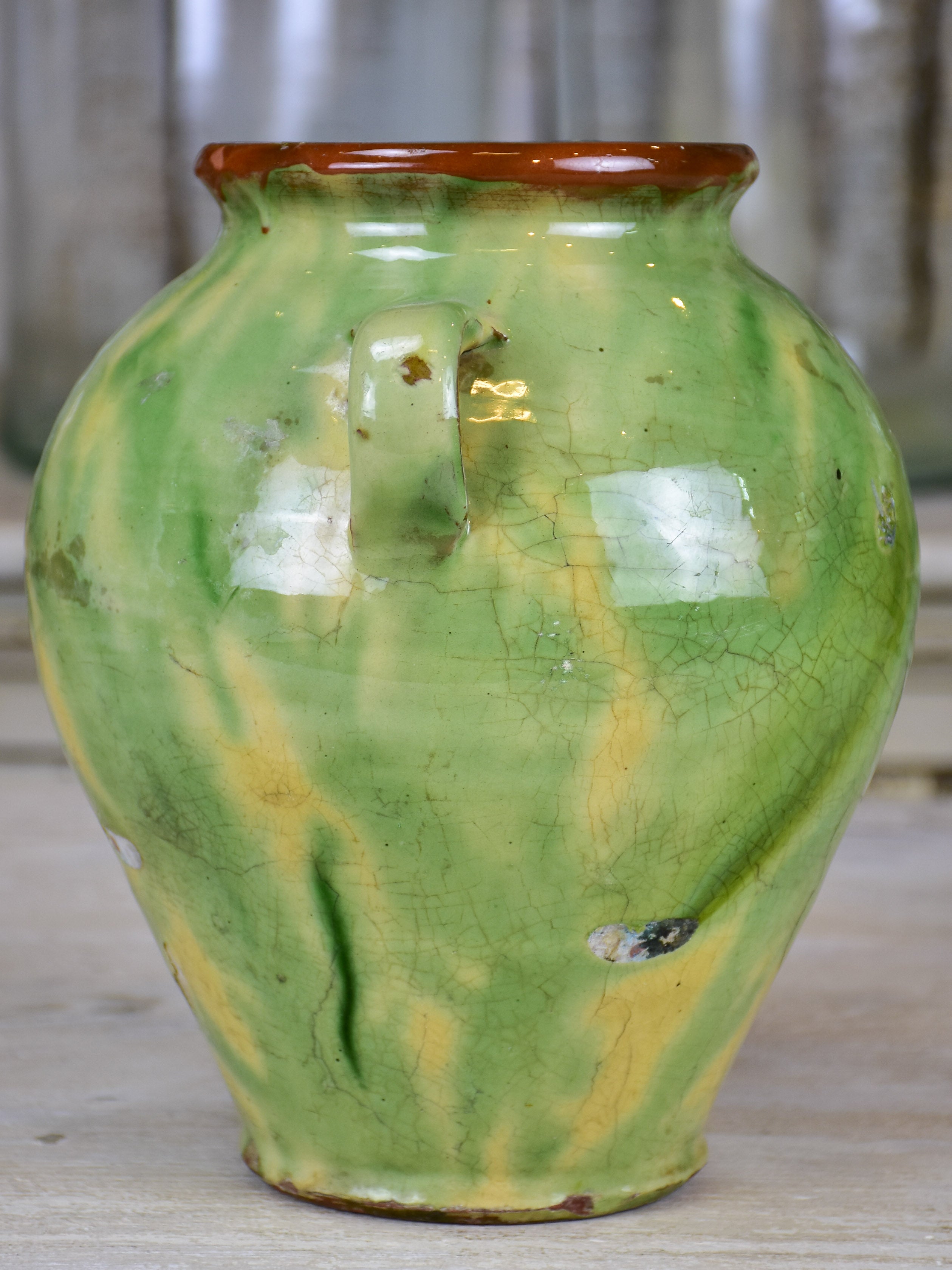 Antique confit pot with yellow and green glaze