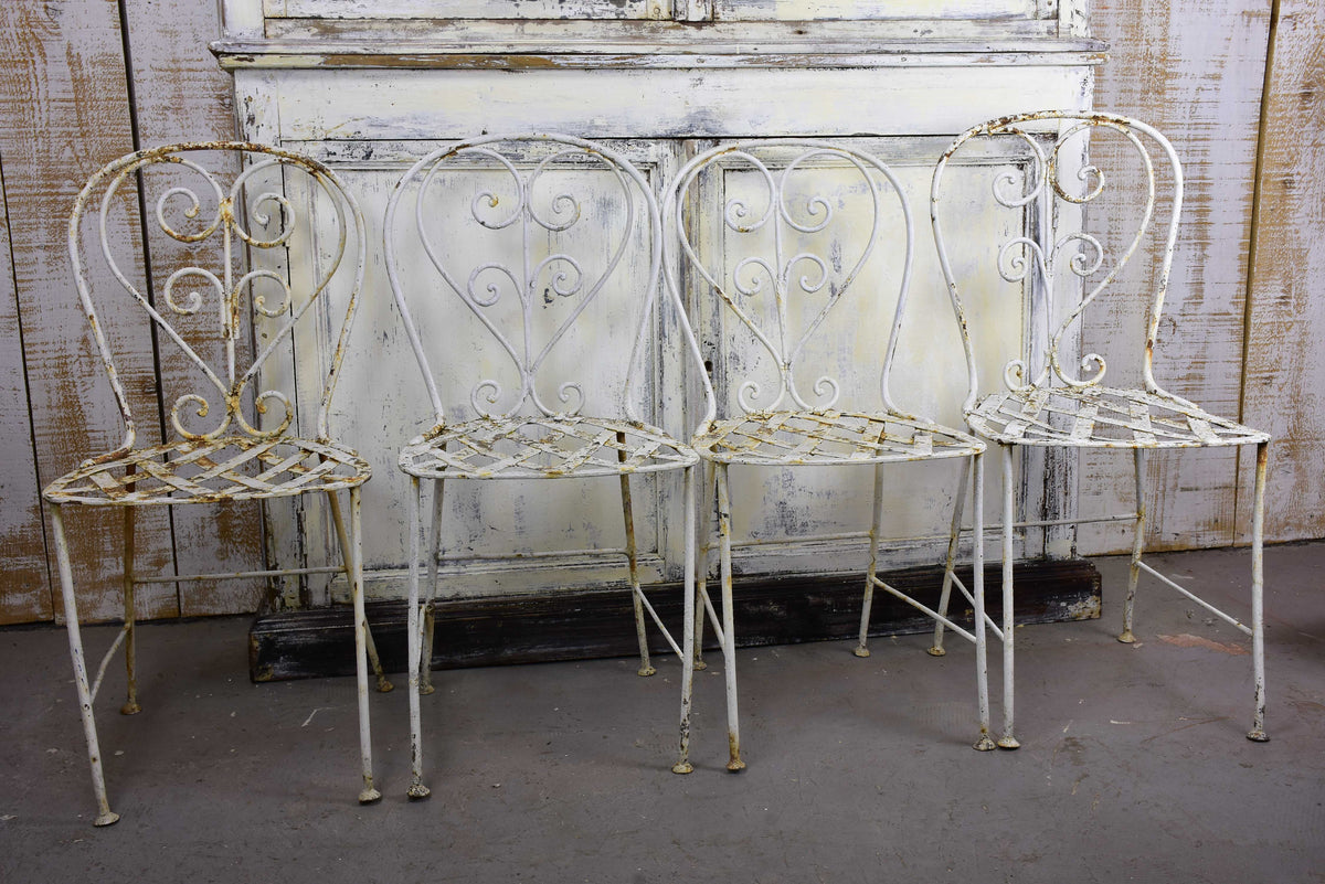 Four antique French garden chairs