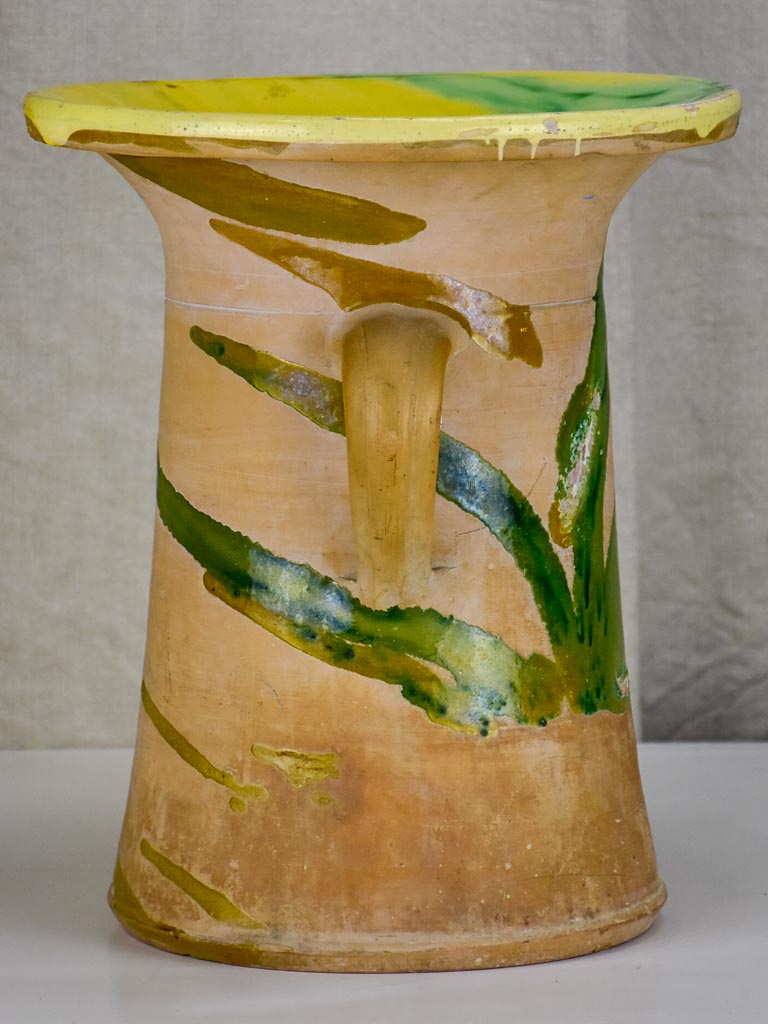 Antique Spanish pot with yellow and green glaze.
