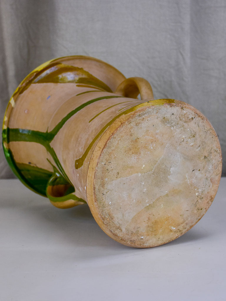 Antique Spanish pot with yellow and green glaze.