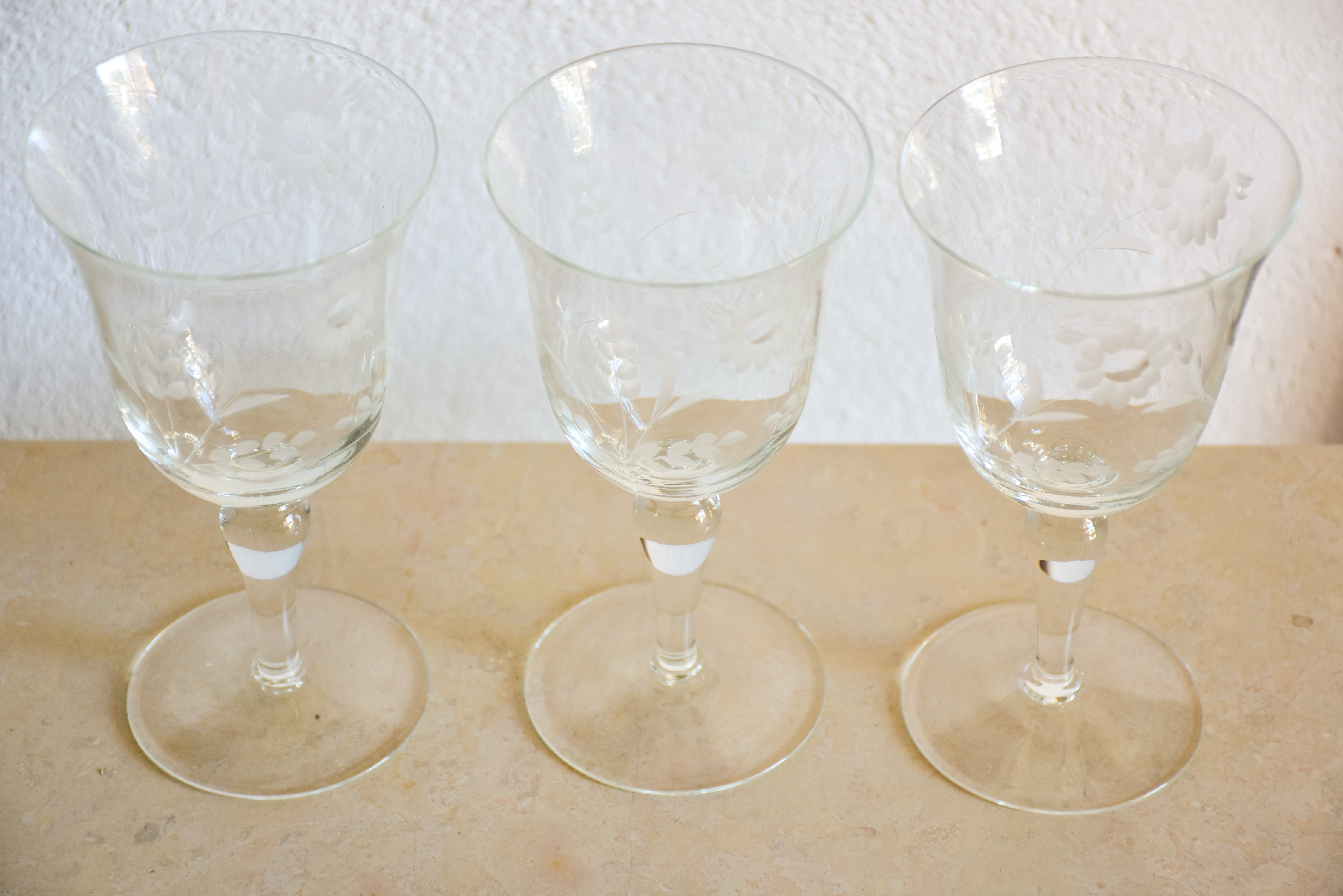 Set of eight vintage red wine glasses with decorative etchings