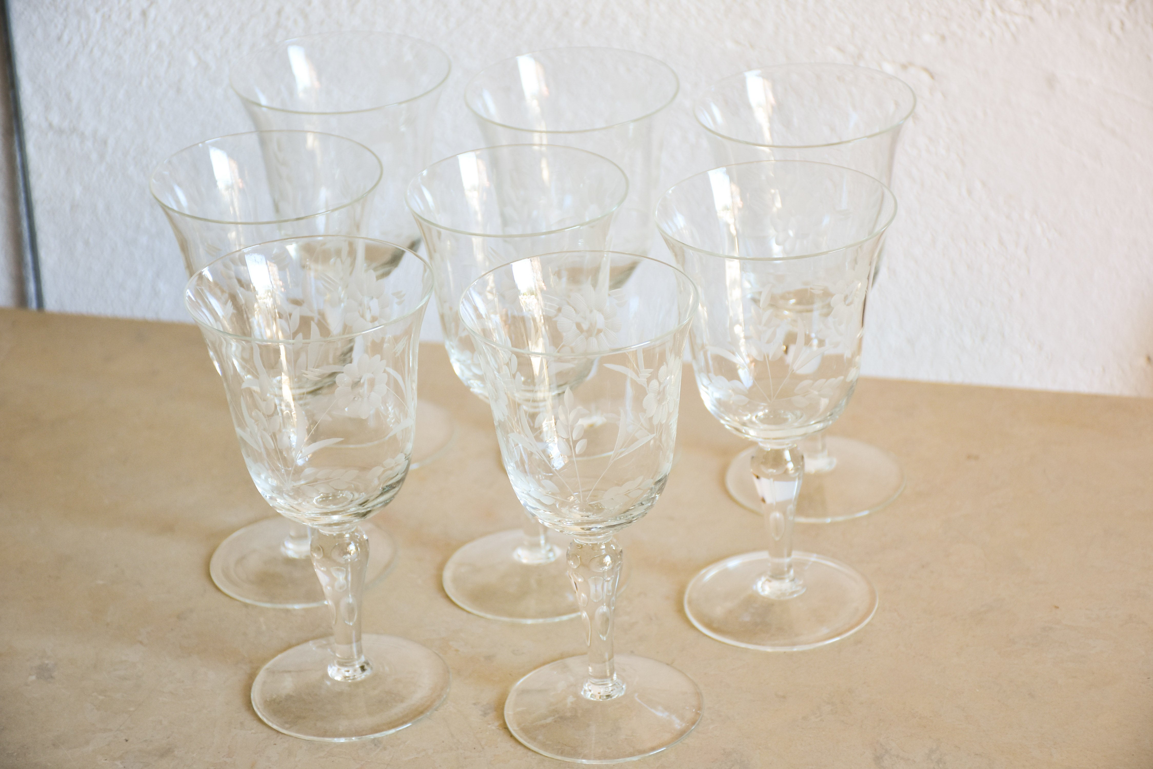 Set of eight vintage red wine glasses with decorative etchings