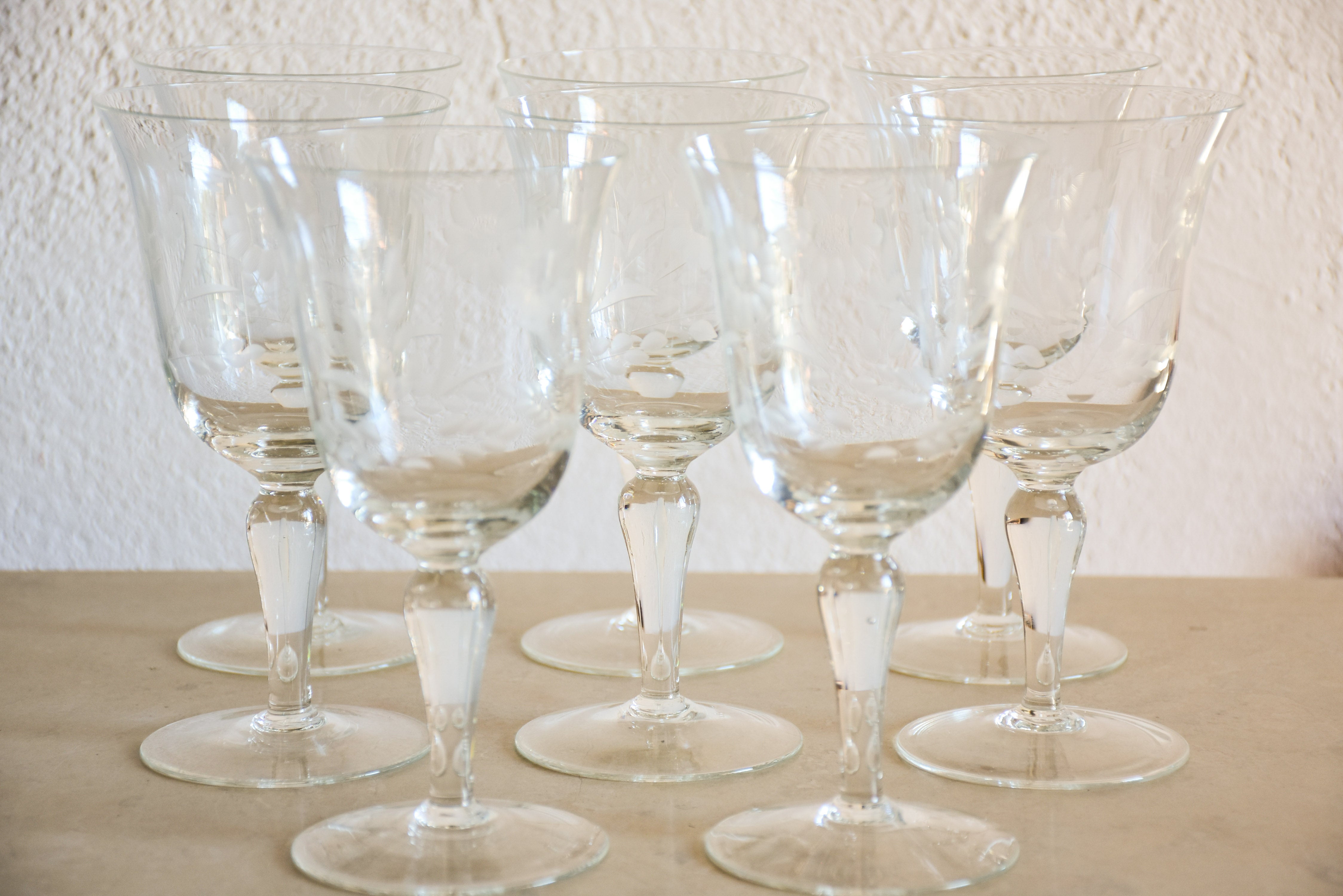 Set of eight vintage red wine glasses with decorative etchings